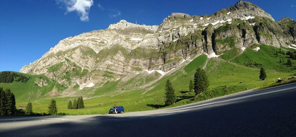 Mountain by road against sky