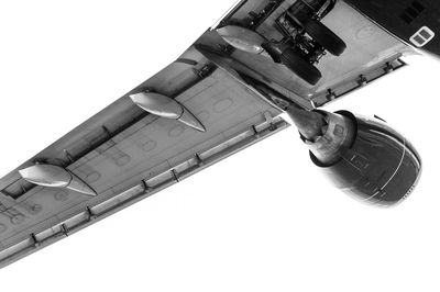 Low angle view of machine part against sky