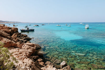 Scenic view of sea against clear sky