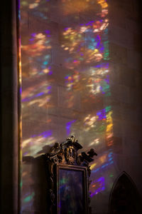 Statue in illuminated room