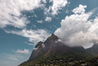 Mountains against cloudy sky