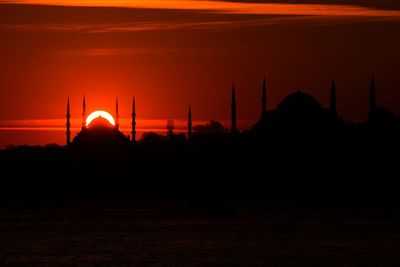 Scenic view of silhouette sultan ahmed mosque and hagia sophia during sunset