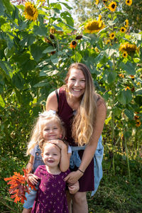 Portrait of smiling girl with plants