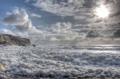 Scenic view of sea against sky during winter