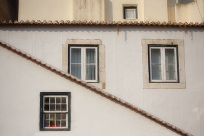 Low angle view of windows on house