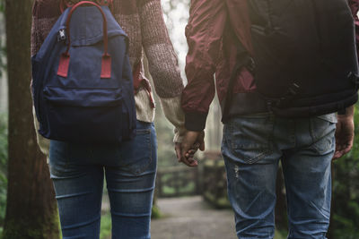 Rear view of couple walking outdoors