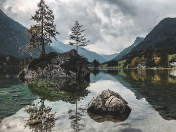 Scenic view of lake and mountains against sky