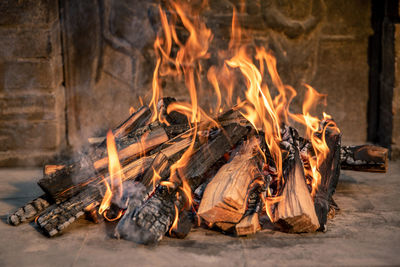Pyre of burning wood with flames. charcoal for grilling meat. wood logs burn in the fireplace