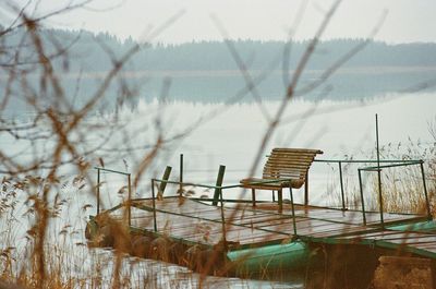 Deck chairs against sky
