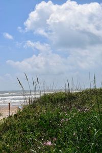 Scenic view of sea against cloudy sky