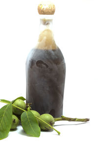 Close-up of fresh green bottle against white background