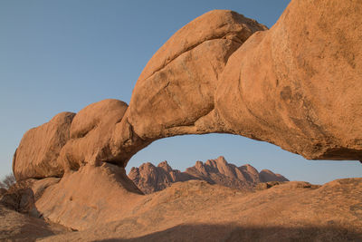 Rock formation in desert against clear sky
