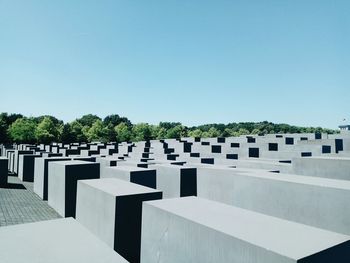 Row of temple against clear blue sky