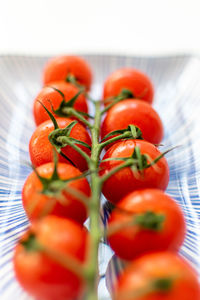 Close-up of tomatoes in plate on table