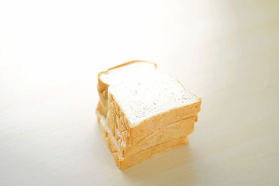 Close-up of cake on table against white background