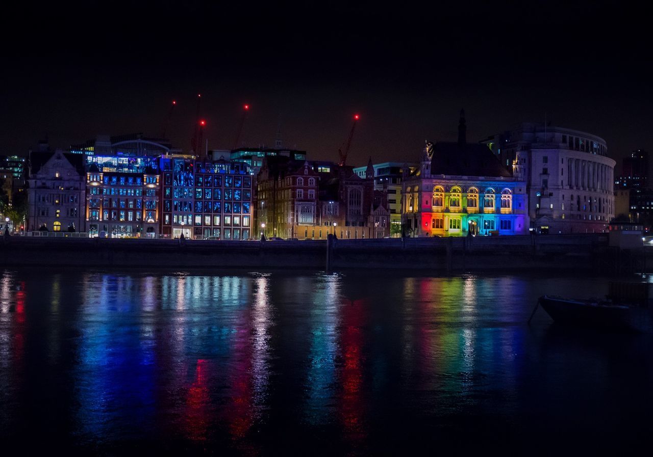 REFLECTION OF ILLUMINATED BUILDINGS IN WATER