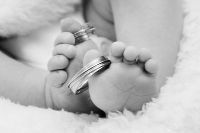 Close-up of hands holding baby hand