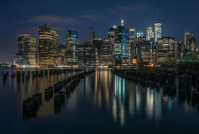 Illuminated city at waterfront