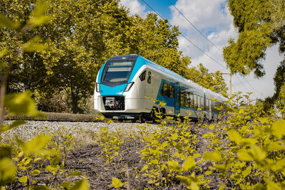 Train on railroad track against sky