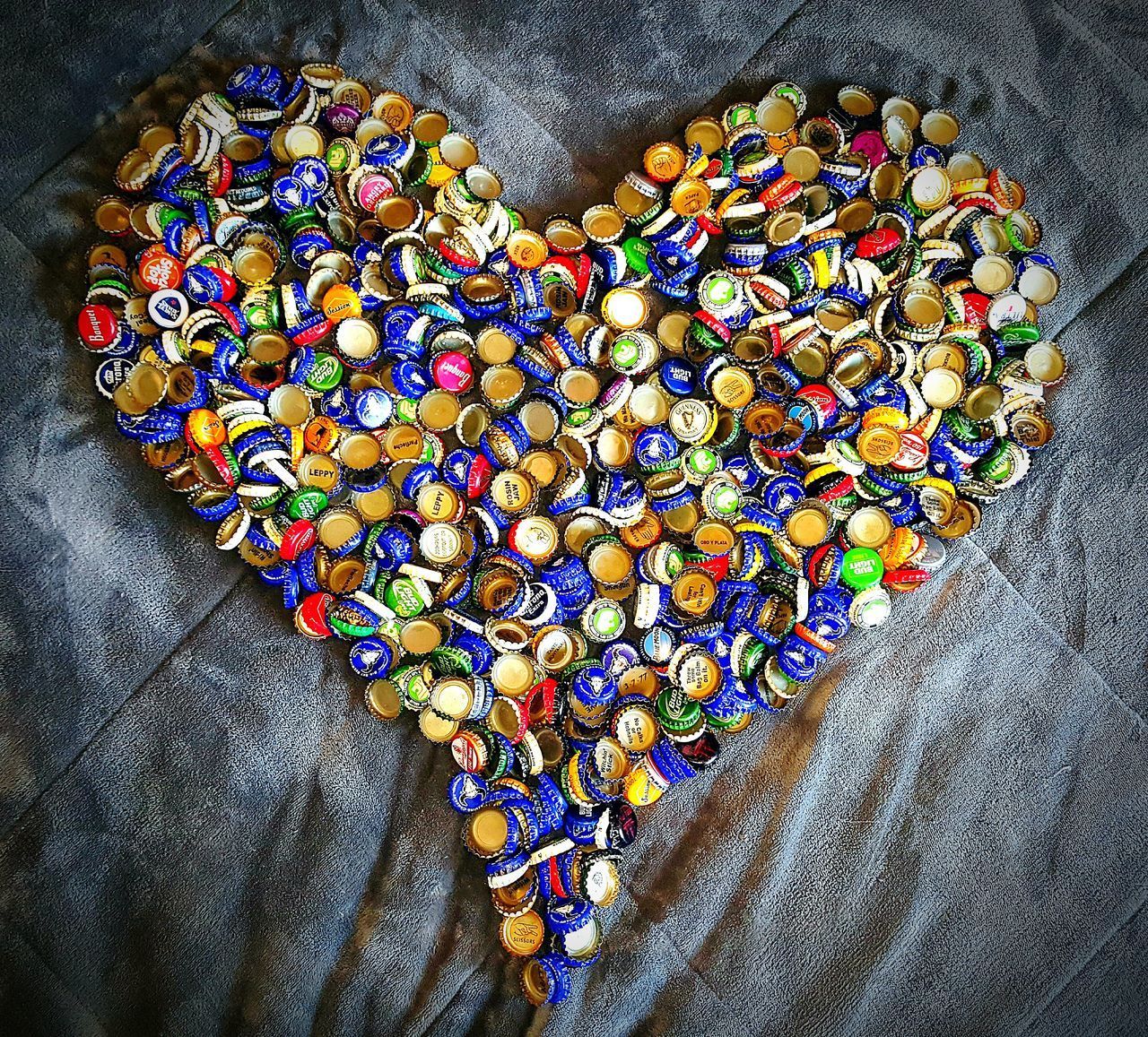 CLOSE-UP OF MULTI COLORED HEART SHAPE ON WALL