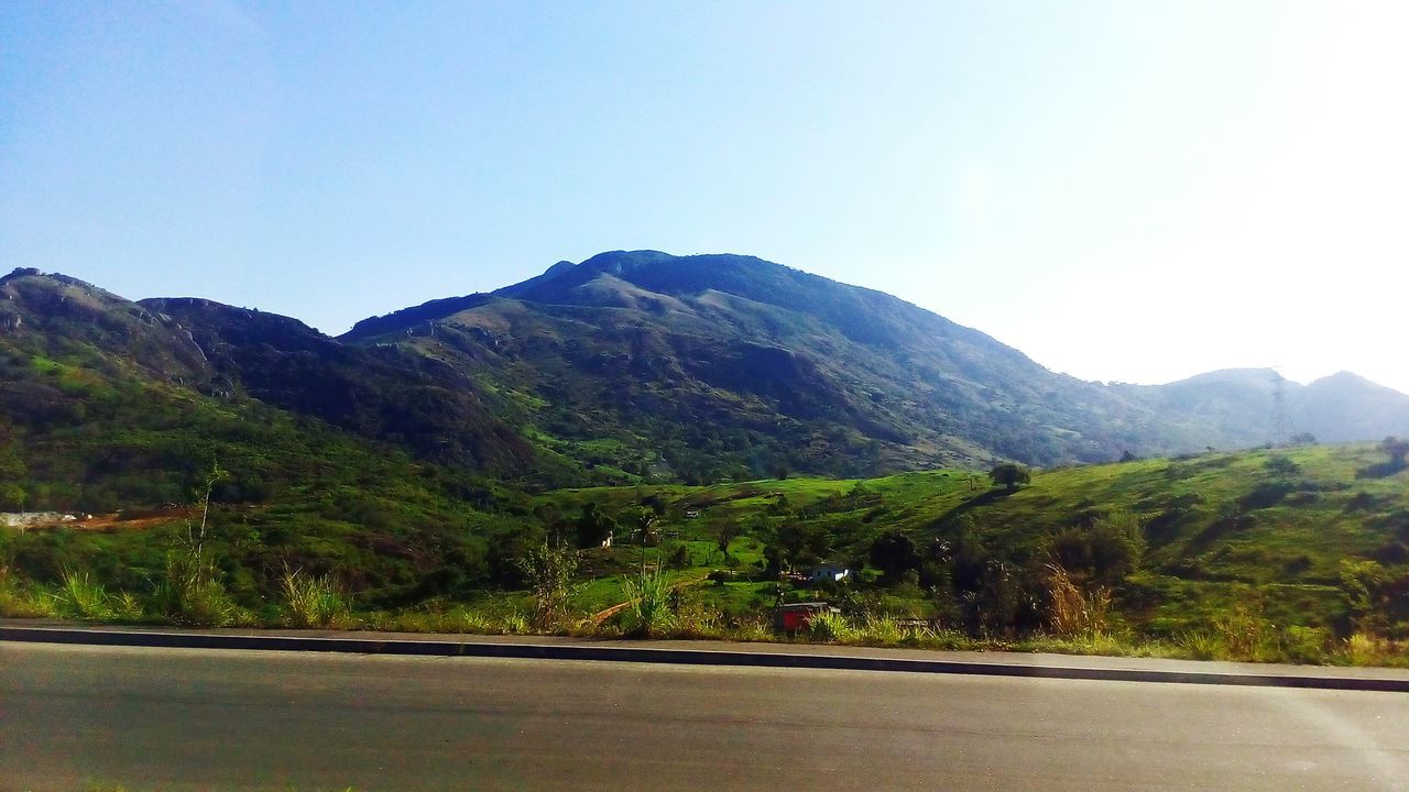 SCENIC VIEW OF MOUNTAINS AGAINST BLUE SKY