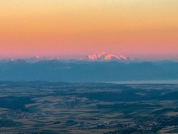 Aerial view of landscape against sky during sunset