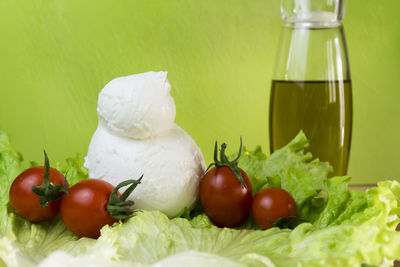 Close-up of fresh tomatoes with vegetables on table