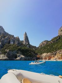 Scenic view of sea against clear blue sky