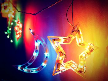 Close-up of illuminated light bulb