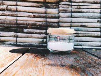 Close-up of glass jar on table