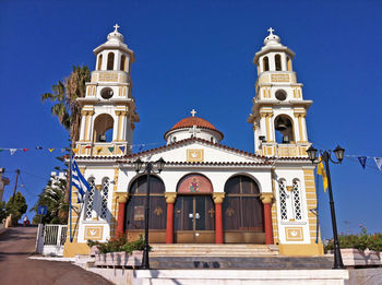 Facade of church against blue sky