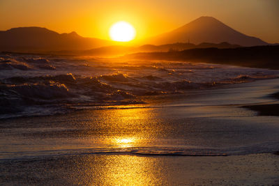 Scenic view of sea against sky during sunset