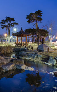 Scenic view of lake against clear sky at dusk