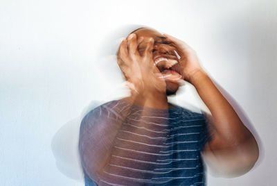 Man in anguish and pain mental health concept showing black or african american man stressed