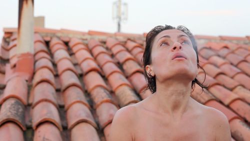 Close up of woman on roof
