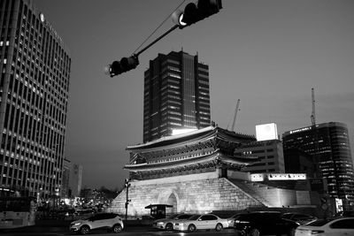 Low angle view of buildings against sky in city