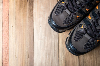 Close-up of hiking boots on wooden table