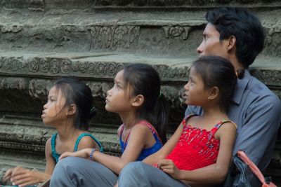 Young women sitting outdoors