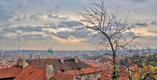 Buildings against cloudy sky