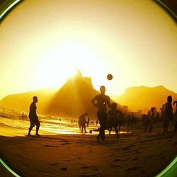 People on beach at sunset