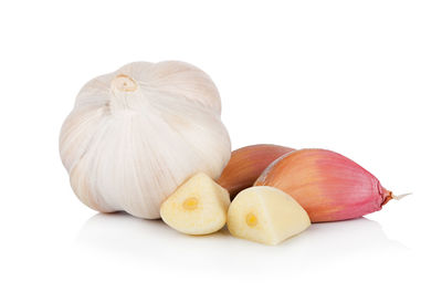 Close-up of pumpkins against white background