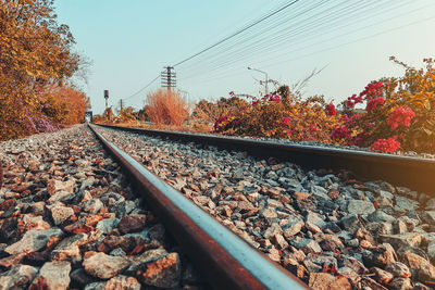 Surface level of railroad track against sky