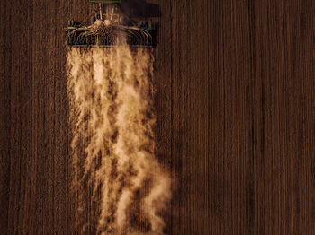 High angle view of combine harvester on agricultural field