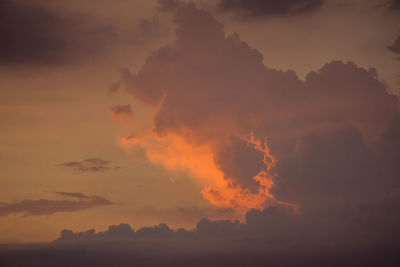 Silhouette mountains against sky at night