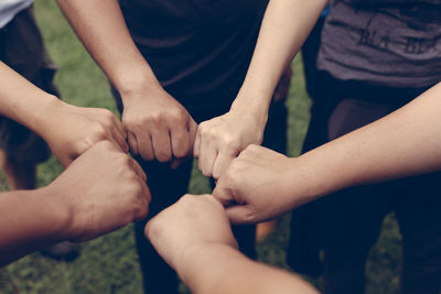 Midsection of man holding hands