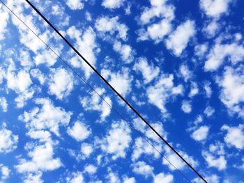 Low angle view of vapor trail against sky