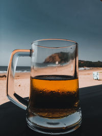 Close-up of beer glass on table