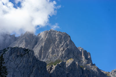 Low angle view of rocks against sky