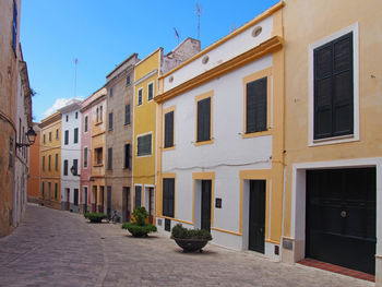 Residential buildings by street in city