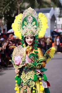 Portrait of woman wearing traditional clothing on road during carnival